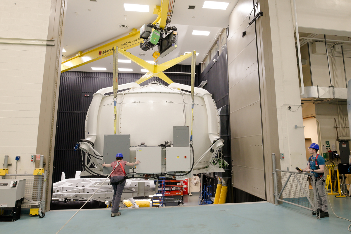 Workers move DriverLab with the overhead crane in CEAL.
